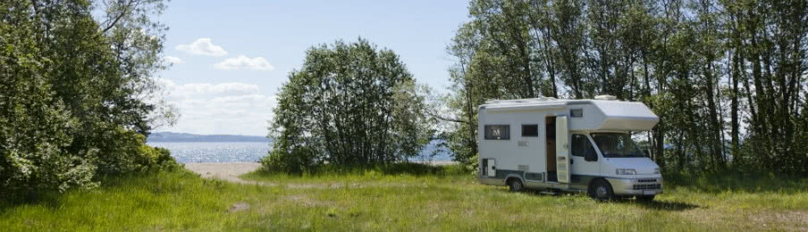campervan parked beside the beach