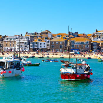 View of St. Ives harbour and beach in Cornwall, UK on a sunny day