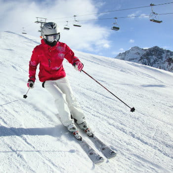 Woman skiing at Nevis Mountain Range in UK
