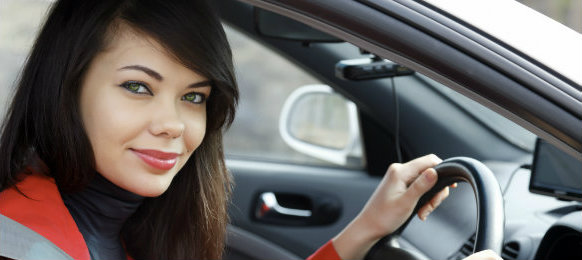 pretty lady smiling while in the car