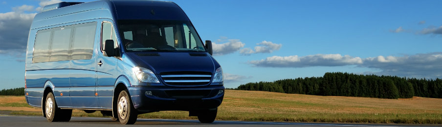 blue campervan on road