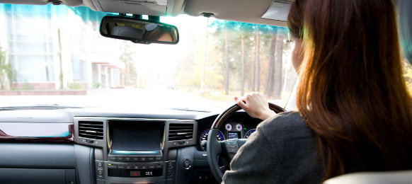 woman driving her new car