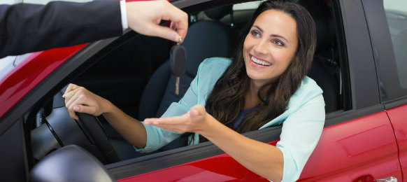 woman receiving her car key