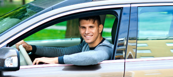 young man in his car hire in sardinia tortoli