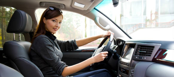 young woman driving the new car hire in prato